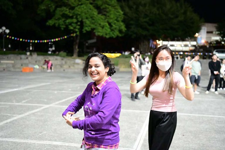 Foreigner students dance together happily