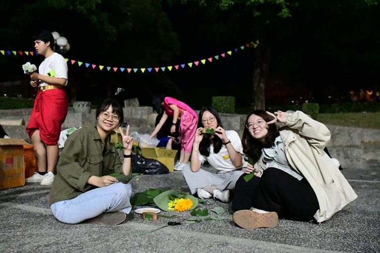student making Loy Krathong