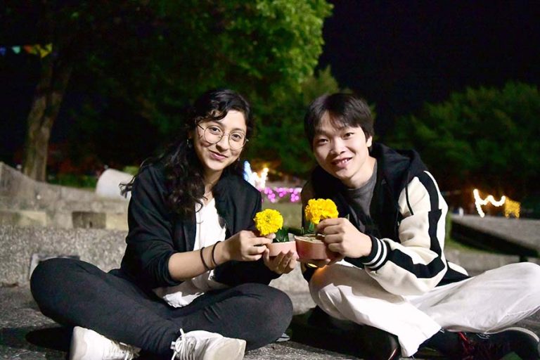 student making Loy Krathong